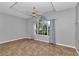 Bright, empty bedroom featuring modern ceiling fan, neutral walls and large window at 2369 Nw 53Rd Avenue Road, Ocala, FL 34482