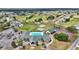 Aerial view of community with pool, tennis, shuffleboard, clubhouse and golf course nearby at 2369 Nw 53Rd Avenue Road, Ocala, FL 34482