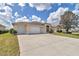 Charming single-story home with two-car garage, well-maintained lawn, and mature landscaping at 2369 Nw 53Rd Avenue Road, Ocala, FL 34482