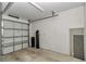 A two car garage with white door and water treatment system at 2369 Nw 53Rd Avenue Road, Ocala, FL 34482