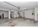 Spacious garage includes water heater, utility sink, and access door to the main home at 2369 Nw 53Rd Avenue Road, Ocala, FL 34482