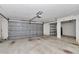 Spacious three car garage with light grey garage doors and water treatment system at 2369 Nw 53Rd Avenue Road, Ocala, FL 34482