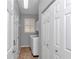 The laundry room features a window with white shutters and a modern washer and dryer at 2369 Nw 53Rd Avenue Road, Ocala, FL 34482
