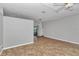 Empty living room featuring vinyl floors and modern light fixtures ready for new owners at 2369 Nw 53Rd Avenue Road, Ocala, FL 34482