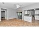 Open concept living room with access to modern kitchen at 2369 Nw 53Rd Avenue Road, Ocala, FL 34482