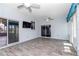 Bright sunroom featuring light blue walls, ceiling fans, and sliding glass doors to the exterior at 2369 Nw 53Rd Avenue Road, Ocala, FL 34482