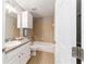 Cozy bathroom design featuring tiled shower, granite countertop sink, and white cabinet at 2689 Sw 165Th Street Rd, Ocala, FL 34473