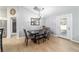 Formal dining area features wood-look tile flooring, modern light fixture and direct access to the back yard at 2689 Sw 165Th Street Rd, Ocala, FL 34473
