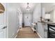 Hallway features light walls, hardwood floor, white trim and a decorative light fixture at 2689 Sw 165Th Street Rd, Ocala, FL 34473