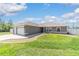 Charming single-story home featuring a two-car garage, landscaped yard and a concrete driveway at 2689 Sw 165Th Street Rd, Ocala, FL 34473