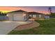 Charming single-story home featuring a two-car garage, landscaped yard and a concrete driveway at 2689 Sw 165Th Street Rd, Ocala, FL 34473