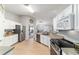 Bright kitchen with stainless steel appliances, white cabinetry, and granite countertops at 2689 Sw 165Th Street Rd, Ocala, FL 34473