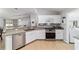 Bright kitchen with stainless steel appliances, granite countertops, and white cabinetry at 2689 Sw 165Th Street Rd, Ocala, FL 34473
