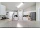 Kitchen bar featuring granite countertops, barstool seating, and stainless steel appliances at 2689 Sw 165Th Street Rd, Ocala, FL 34473