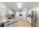 Bright kitchen with stainless steel appliances, white cabinetry, and granite countertops at 2689 Sw 165Th Street Rd, Ocala, FL 34473