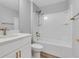 Bathroom featuring a shower-tub combo, single sink, and bronze fixtures at 3 Redwood Track Run, Ocala, FL 34472