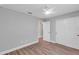 Empty bedroom featuring laminate flooring and a sliding door closet at 3 Redwood Track Run, Ocala, FL 34472