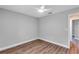 Empty bedroom featuring laminate flooring and a ceiling fan at 3 Redwood Track Run, Ocala, FL 34472