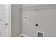 Bright laundry room with hookups and wire shelving at 3 Redwood Track Run, Ocala, FL 34472
