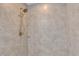 Close up of the tiled shower featuring bronze shower head at 3 Redwood Track Run, Ocala, FL 34472