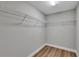 Empty walk-in closet with laminate flooring and wire shelving at 3 Redwood Track Run, Ocala, FL 34472