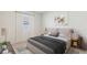 Comfortable bedroom with soft lighting, stylish decor, and large windows at 3059 Canopy Oak Blvd, Wildwood, FL 34785
