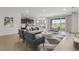 Bright living area featuring neutral tones, stylish furniture, and outdoor access at 3059 Canopy Oak Blvd, Wildwood, FL 34785