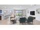 Open-concept living room with sliding glass doors and modern decor at 3059 Canopy Oak Blvd, Wildwood, FL 34785
