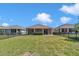 View of back of home with fenced in yard, landscaping, and adjacent homes at 3918 Nw 46Th Ter, Ocala, FL 34482