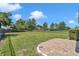 Large backyard with brick paver patio and mature trees and landscaping at 3918 Nw 46Th Ter, Ocala, FL 34482