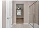 Bathroom with glass shower door, access to bedroom with carpet, and neutral tile flooring at 3918 Nw 46Th Ter, Ocala, FL 34482