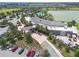 Aerial view of the community center featuring a spacious design, palm trees, and ample parking at 3918 Nw 46Th Ter, Ocala, FL 34482