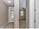 Entryway featuring wood floors and views into the living room with a ceiling fan and window at 3918 Nw 46Th Ter, Ocala, FL 34482
