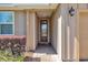 Inviting front entrance with a brick pathway leading to a wood door with glass inserts at 3918 Nw 46Th Ter, Ocala, FL 34482