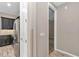 Hallway featuring access to the kitchen with stainless steel appliances and gray color scheme at 3918 Nw 46Th Ter, Ocala, FL 34482