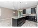 Modern kitchen features an island with drawers, stainless appliances and granite counters at 3918 Nw 46Th Ter, Ocala, FL 34482