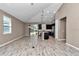 An open-concept living room connects to the kitchen, offering a seamless flow at 3918 Nw 46Th Ter, Ocala, FL 34482