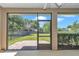 View of the brick paver patio outside the door of the screened in lanai at 3918 Nw 46Th Ter, Ocala, FL 34482
