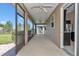 Relax on the screened patio with ceiling fans and view of the spacious backyard at 3918 Nw 46Th Ter, Ocala, FL 34482