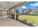 Enjoy the weather from this screened patio, with a view of the manicured lawn and landscaping at 3918 Nw 46Th Ter, Ocala, FL 34482