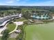 Beautiful aerial view showcasing an expansive community pool, patio, and well-manicured landscaping near the lake at 3918 Nw 46Th Ter, Ocala, FL 34482