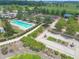 Overhead shot displays a recreation area featuring a pool, tennis courts, and bocce ball area with landscaping at 3918 Nw 46Th Ter, Ocala, FL 34482