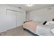 Bright bedroom featuring carpeting, a closet, and a comfortable bed with light blanket at 4085 Sw 110Th St, Ocala, FL 34476