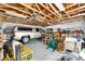 Spacious garage with exposed rafters, work benches, a truck, and ample room for storage and projects at 4085 Sw 110Th St, Ocala, FL 34476