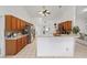 Kitchen featuring a breakfast bar, tile flooring, and wood cabinetry at 4085 Sw 110Th St, Ocala, FL 34476
