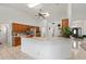 Kitchen with tile flooring, breakfast bar, stainless steel appliances, and wood cabinetry at 4085 Sw 110Th St, Ocala, FL 34476