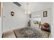 Cozy room with a large rug and chandelier, well-lit by a bright window at 4085 Sw 110Th St, Ocala, FL 34476