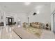 Large, open-plan living room featuring high ceilings and seamless transition from tile to carpet flooring at 4085 Sw 110Th St, Ocala, FL 34476