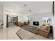 Bright living room with neutral-toned walls, tile flooring, carpet, and a sliding glass door at 4085 Sw 110Th St, Ocala, FL 34476