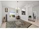 Inviting room with natural light, featuring a patterned rug and traditional decor elements at 4085 Sw 110Th St, Ocala, FL 34476